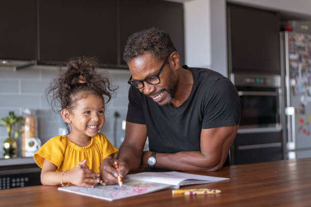 istock Loving father coloring with adorable daughter 1288920968