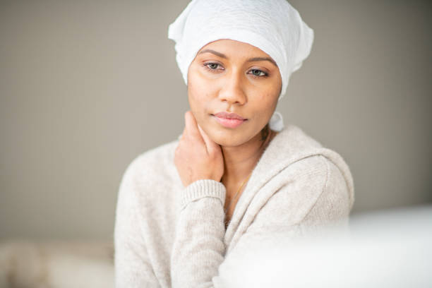 istock Beautiful cancer patient at home 1288921241