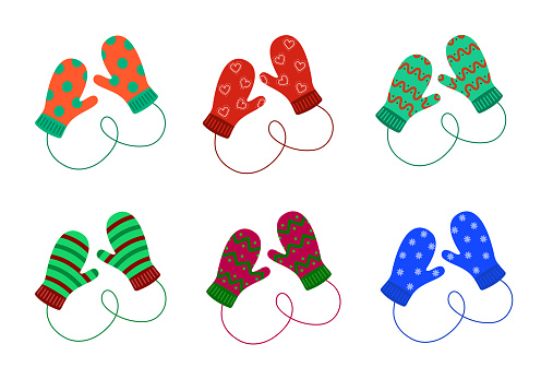 Pair of knitted mittens set. Woolen christmas mittens with different patterns isolated on the white background. Vector illustration