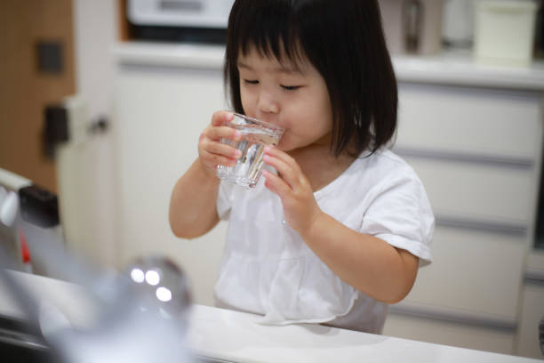 istock Girl drinking tap water 1288924430