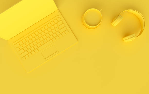 istock Laptop, phone, headphones, cup of coffee 3d rendering. Remote work, freelance, work space, lockdown, stay at home concept. Top view, yellow color 1288925220