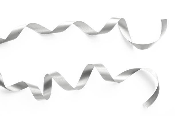 istock Silver satin ribbon bow scroll set isolated on white background with clipping path for Christmas and wedding card design decoration 1288926649
