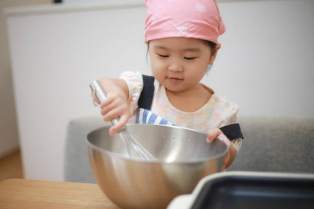 istock Girl cooking 1288926724