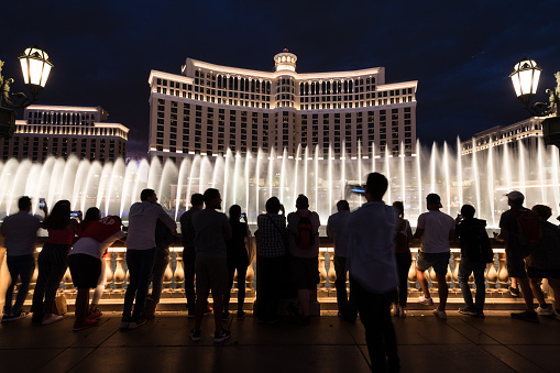 Las Vegas, USA - Sep 23, 2019: People watching the free Bellagio water show at twilight on the Strip early in the night.