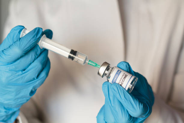 istock Doctor preparing Coronavirus or Covid-19 vaccine 1288931132