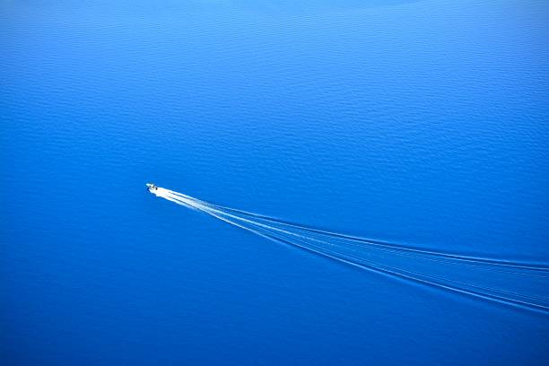istock Sailing alone on the blue lake 1288934118