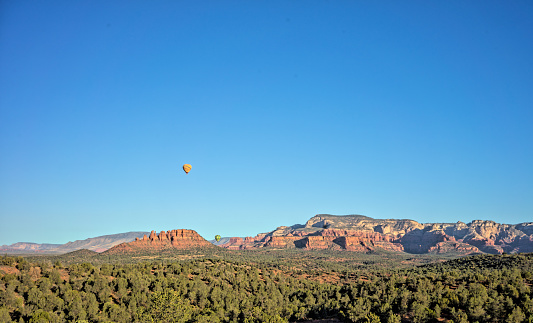 Hot air balloons over red rocks of Sedona, Arizona.
