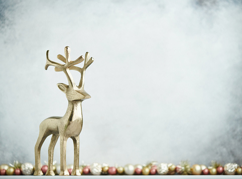 Christmas Background with reindeer and rose pink and gold decorations
