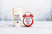 Make 2021 Amazing. Happy New Year Background with Clock and Coffee Cup
