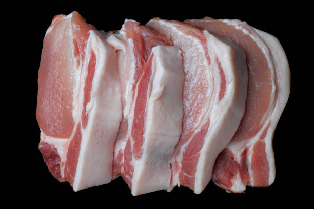 Pork meat steaks close-up on a black background, isolate, close-up, top view.