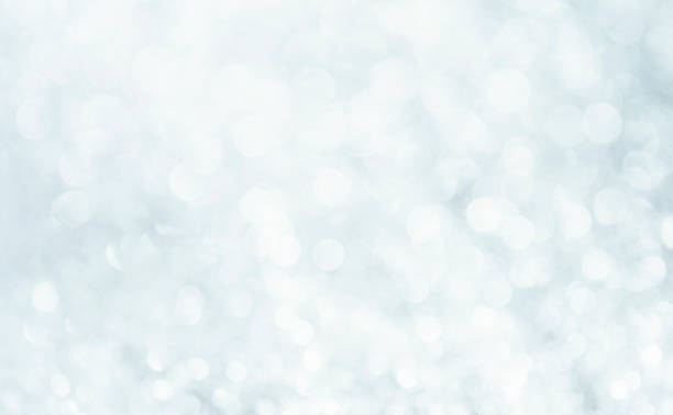 istock White glitter blur vintage lights background. Bokeh silver and white. de-focused celebration. 1288938603