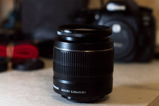 istock Lens on the table and a camera in the background 1288939944