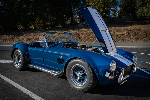 Placerville, USA - November 25, 2020: Classic rare American muscle car, convertible vintage blue 1967 Ford Shelby Cobra 427