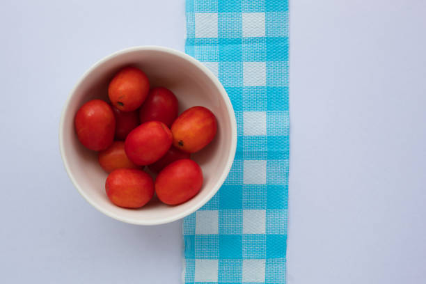 istock A bowl of plum and a napkin. 1288942884
