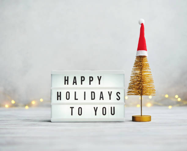 istock Gold Christmas Tree Holiday Background with Happy Holidays Message 1288943077