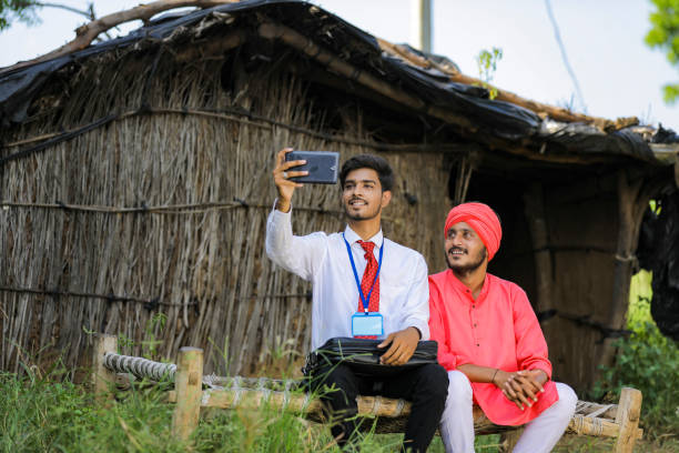 istock Young Indian agronomist taking selfie with farmer 1288948311