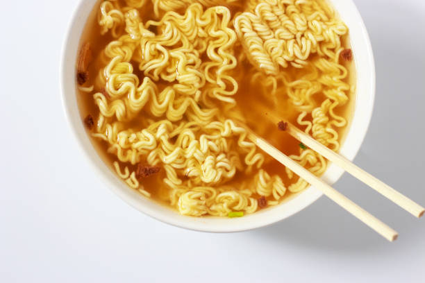 istock Instant noodles in bowls on white background top view 1288949230