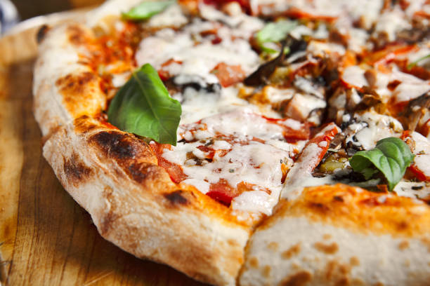 istock Pizza with mushroom and tomato 1288950596