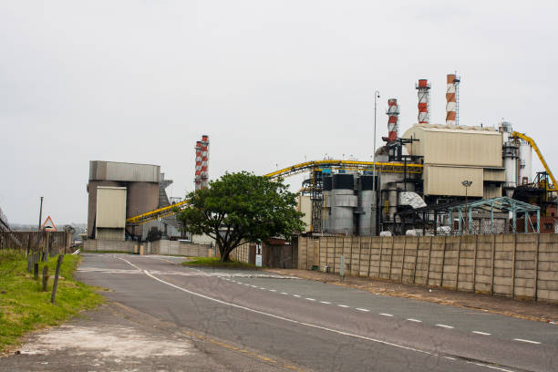 istock Roadway Running Alongside Industrial Production Mill 1288951179