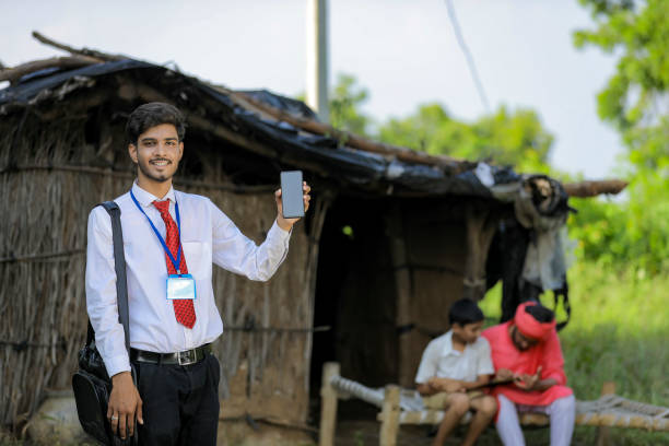 istock Young indian bank officer showing mobile screen with farmer 1288952942