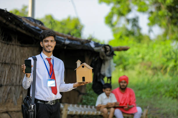 istock Young indian bank officer showing mobile screen with farmer 1288954829