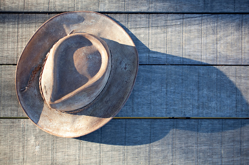 Cowboy hat  on wood background.