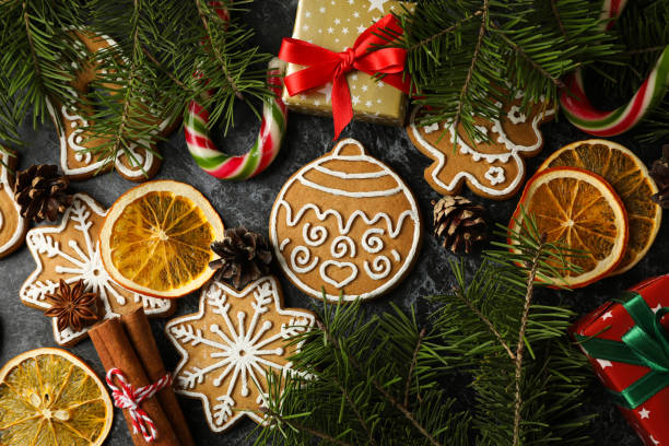 istock Christmas concept with cookie on black smokey background, top view 1288957579