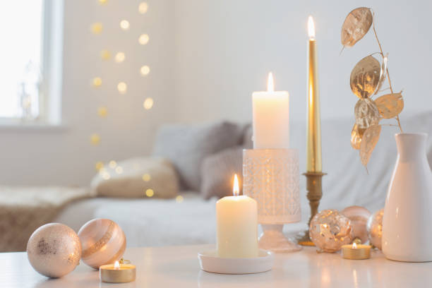 istock Christmas decorations with candles at home 1288957687