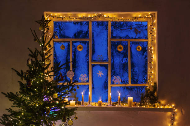 istock Christmas decorations on old wooden window 1288957691