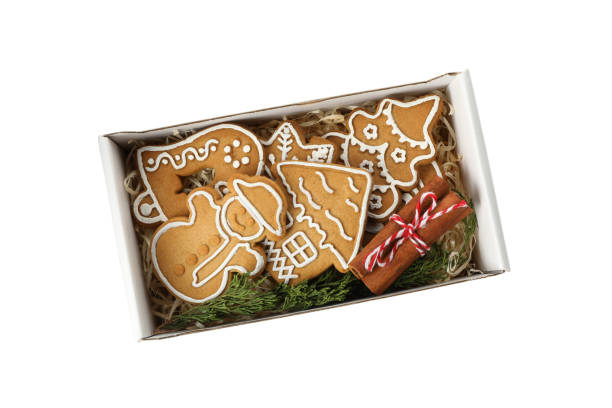 istock Box with tasty Christmas cookie isolated on white background 1288957753