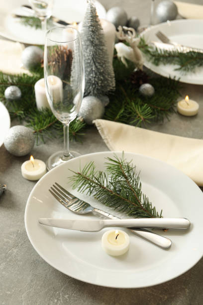 istock Concept of romantic New year table setting on gray table 1288959666