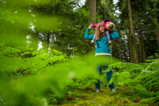 istock Mother carrying her daughter 1288959712