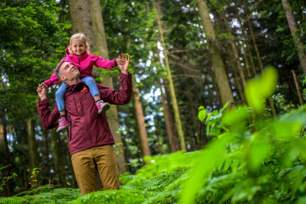 istock Father carrying his daughter 1288959845