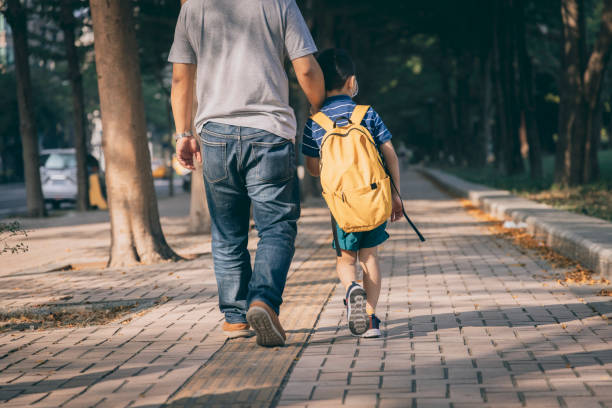 istock Father and son going to kindergarten 1288962071