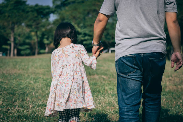 istock father play with kid outdoor 1288962117