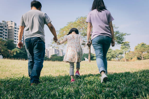istock Parents play with kid outdoor 1288962125