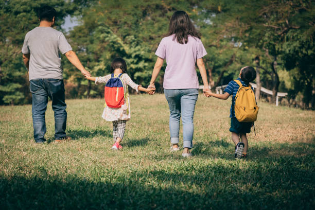 istock Parents play with kid outdoor 1288962127