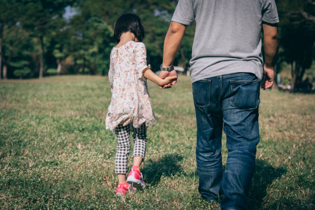 istock father play with kid outdoor 1288962134