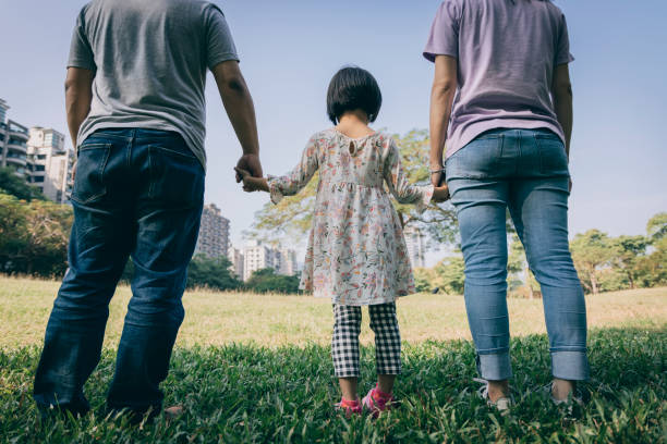 istock Parents play with kid outdoor 1288962141