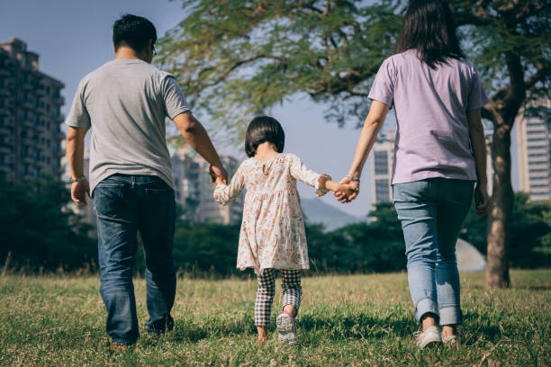 istock Parents play with kid outdoor 1288962147