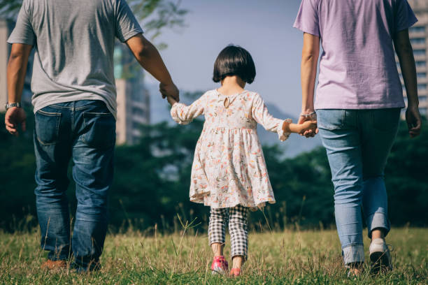 istock Parents play with kid outdoor 1288962149