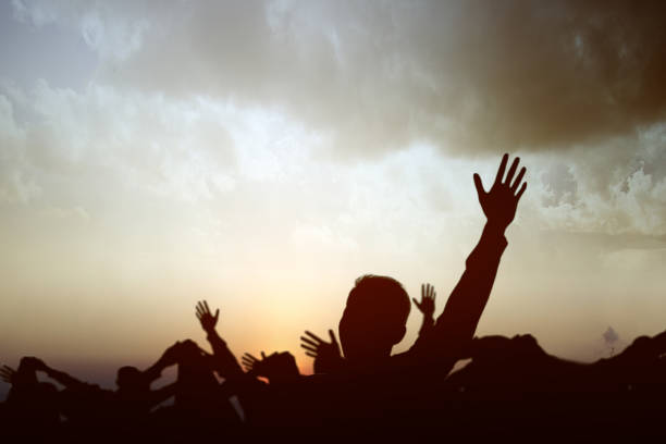 istock The crowd of people raised hands together 1288962153