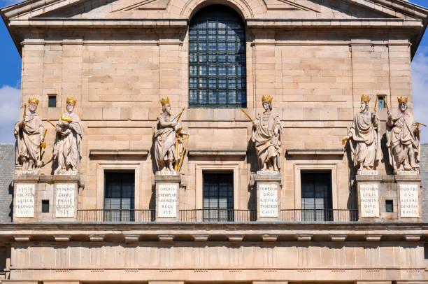 Madrid, Spain - June 2019: Statues on El Escorial palace facade outside Madrid