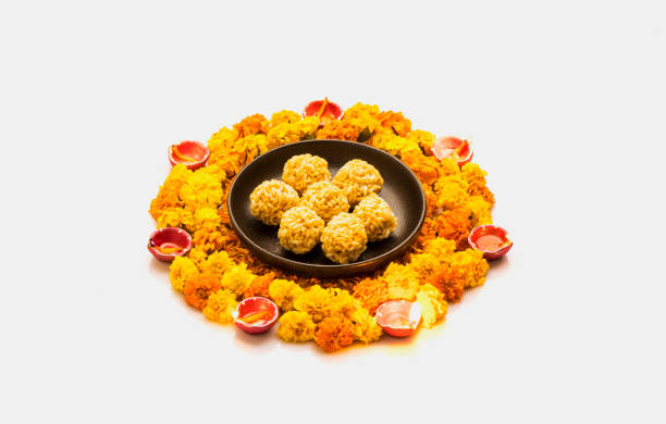 istock puff rice balls kept with flower for puja in India 1288966085