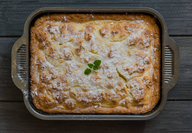 istock Shortbread pie with cream and cottage cheese filling on a wooden table, rustic style 1288967084