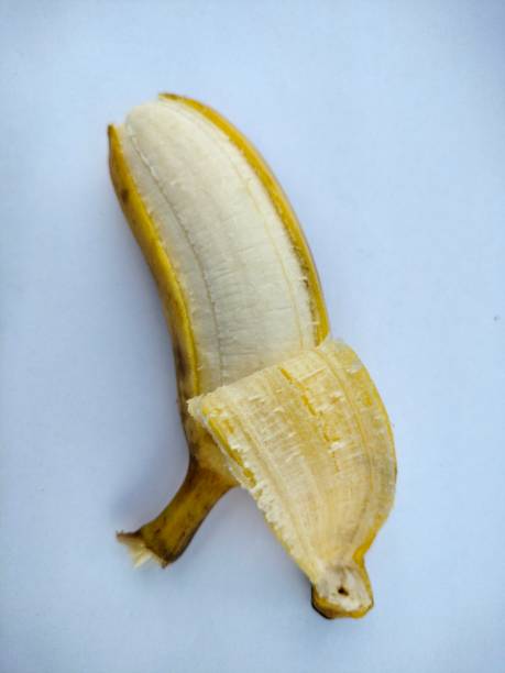 istock Banana peel on white 1288969659