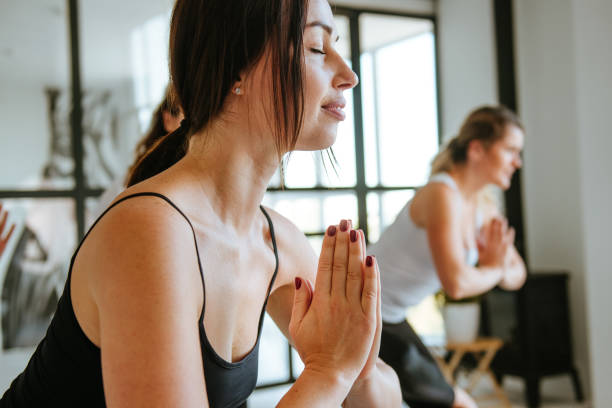 istock Yoga class of young people group indoor 1288970618