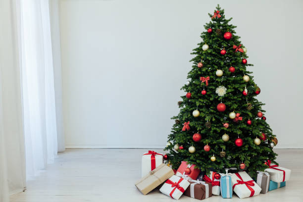 istock beautiful Christmas tree with gifts decor new year 1288971071