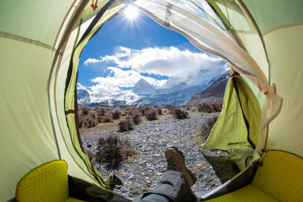 istock Hiker enjoy the beautiful landscape in tent 1288971082