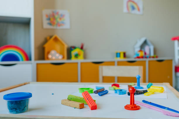 istock Table with kids molding colorful clay 1288971277
